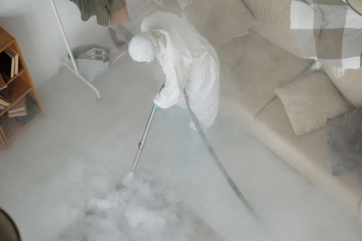 Biohazard cleanup technician in protective equipment, Windsor Locks, CT